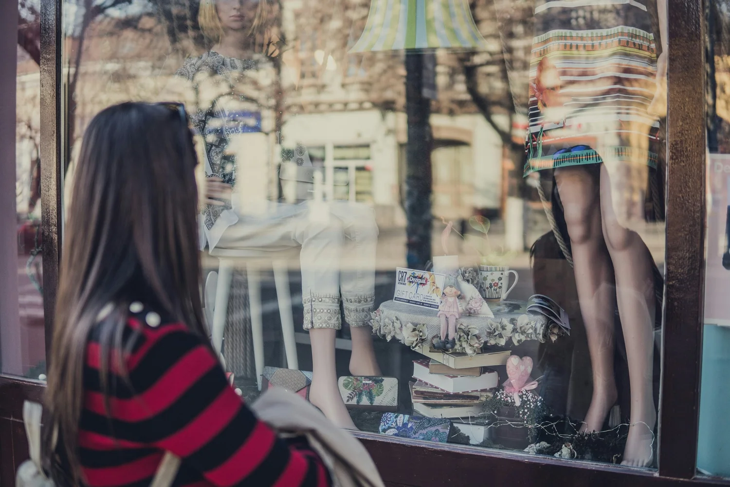 A shopfront window showing a deal on Streetify.